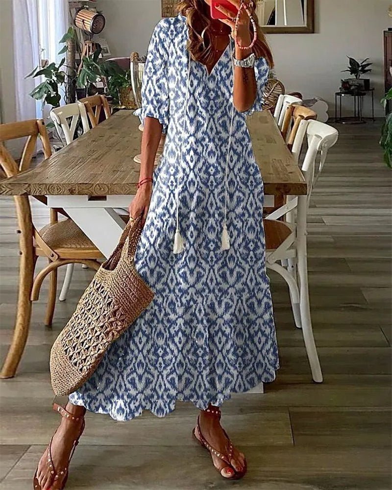 Boho midi jurk met geometrische print, pompon koordjes bij de hals en ruches