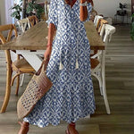 Boho midi jurk met geometrische print, pompon koordjes bij de hals en ruches