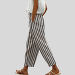 Comfortabele damesbroek in effen kleur met elastische tailleband, soepele val en diepe zakken