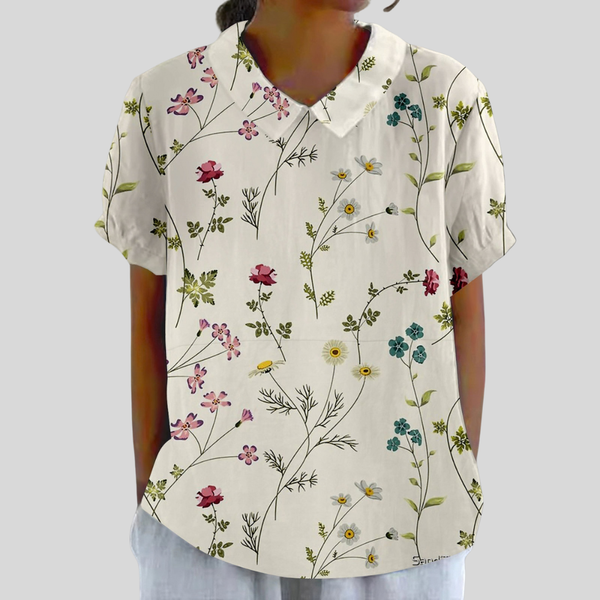 Sierlijke dames top met bloemenprint, verfijnde polokraag en vloeiende vrije snit