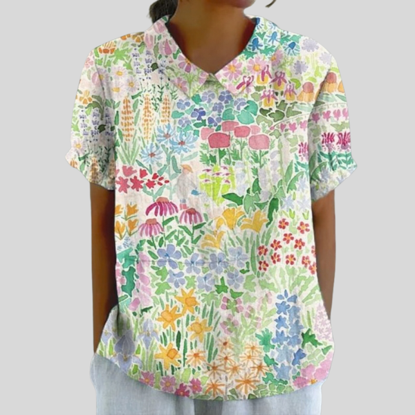 Elegante dames top met bloemenprint en verfijnde polokraag in een vloeiende pasvorm