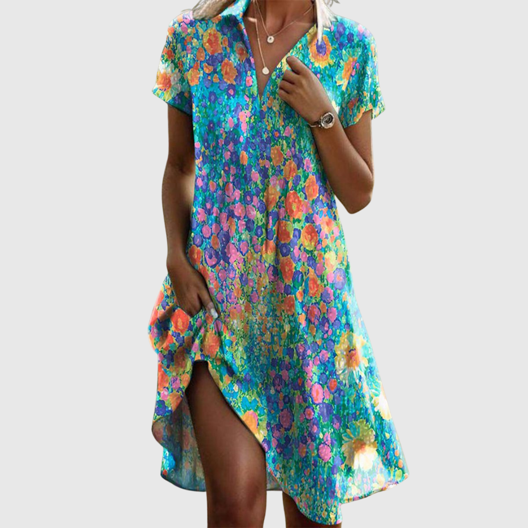 Vrolijke zomerjurk met kleurrijke bloemenprint, V-hals en asymmetrische zoom