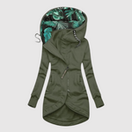 Elegante lange dames parka met capuchon en diepe steekzakken in effen kleur