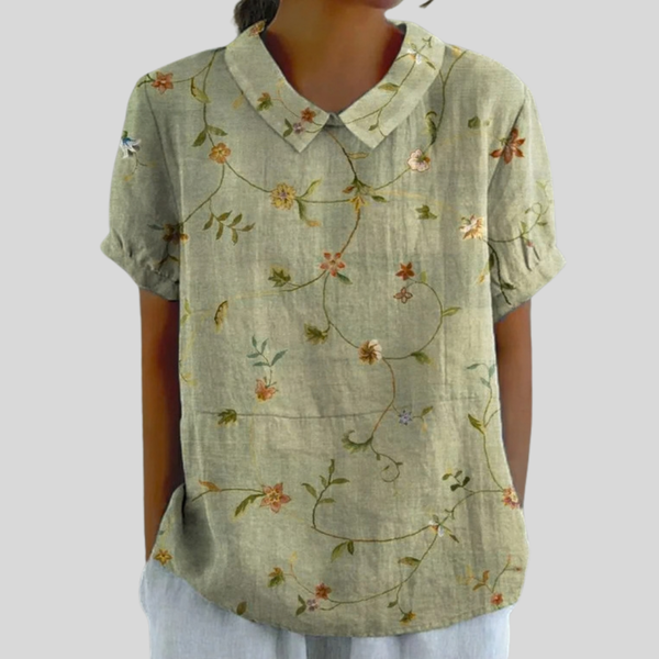 Elegante dames top met bloemenprint, polokraag en een vloeiende, ruime pasvorm