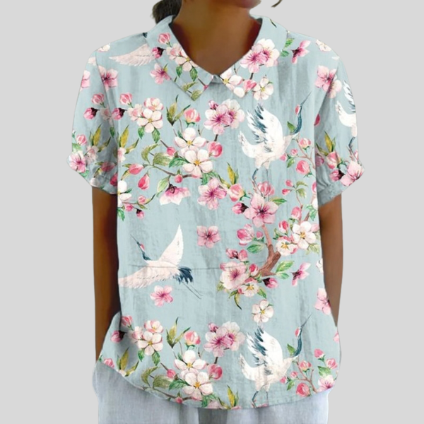 Luchtige dames top met bloemenprint en ruime pasvorm voor warme en koele dagen