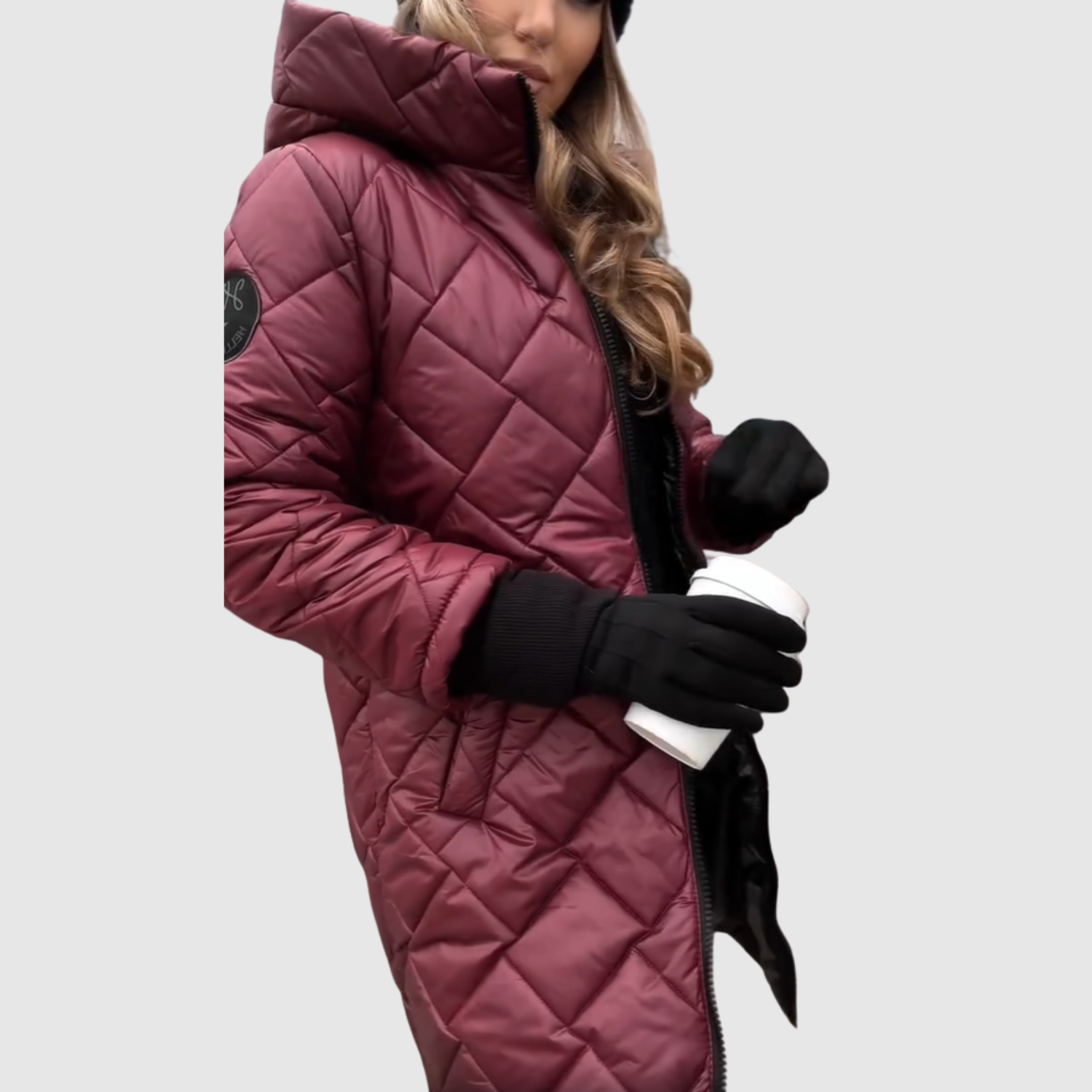 Elegante lange gewatteerde dames winterjas met capuchon en diepe steekzakken