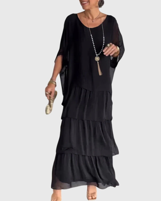 Elegante lange jurk met vloeiende val in een tijdloze effen kleur voor dames
