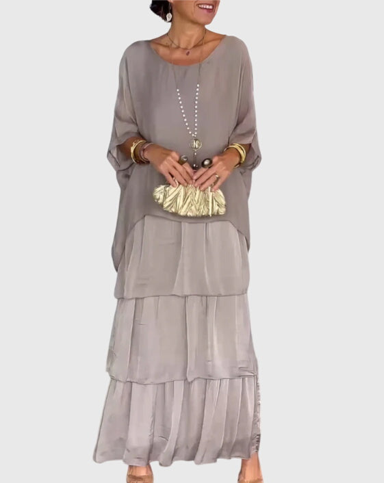 Elegante lange jurk met vloeiende val in een tijdloze effen kleur voor dames