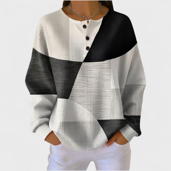 Manon dames monochrome trui met kleurvlakken en wafelstructuur
