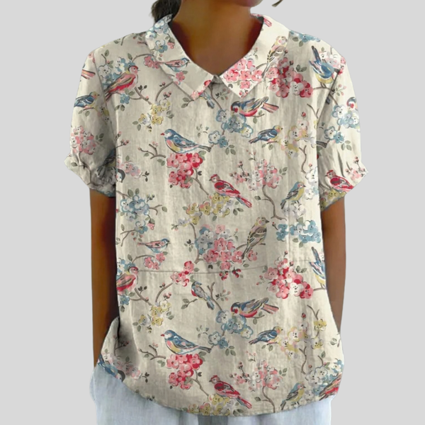 Elegante bloementop voor dames met ruime snit en fijne bloemenprint in warme tinten