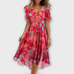 Elegante jurk met V-hals, aansluitend silhouet en soepel vallende nette stof