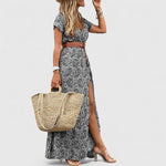 Lange elegante boho maxi jurk met zomerse print en gerimpelde elastische taille